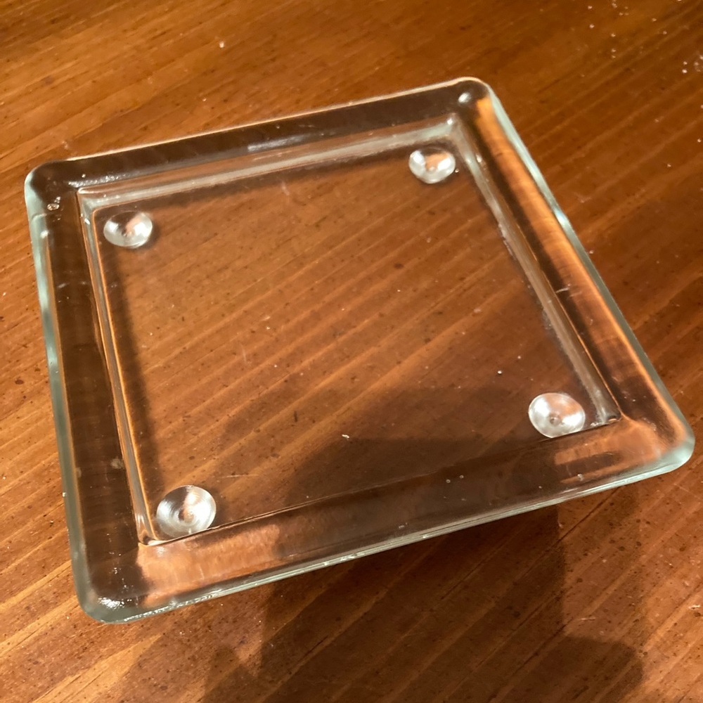 Glass Candle holder with 4 tabs on the bottom 5 inches across both ways